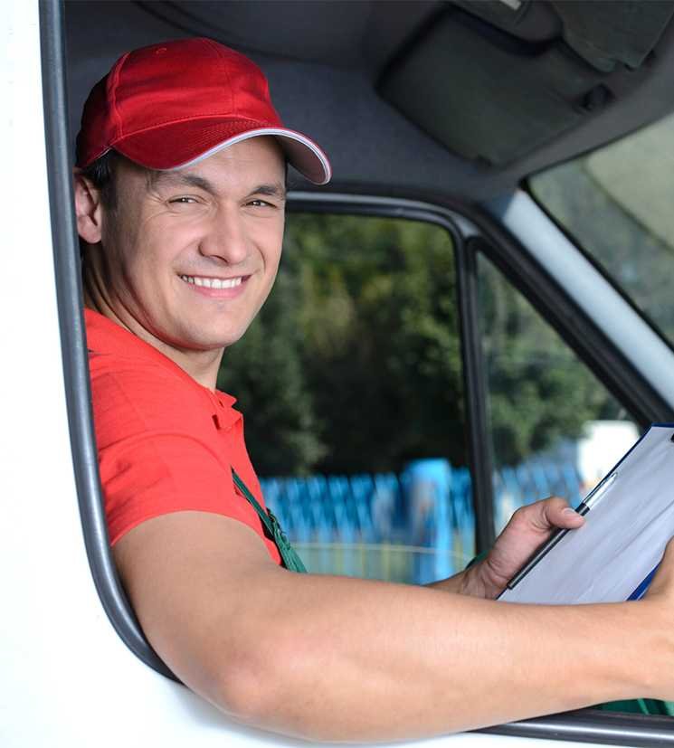 Removalist Truck Driver Smiling and Driving Truck